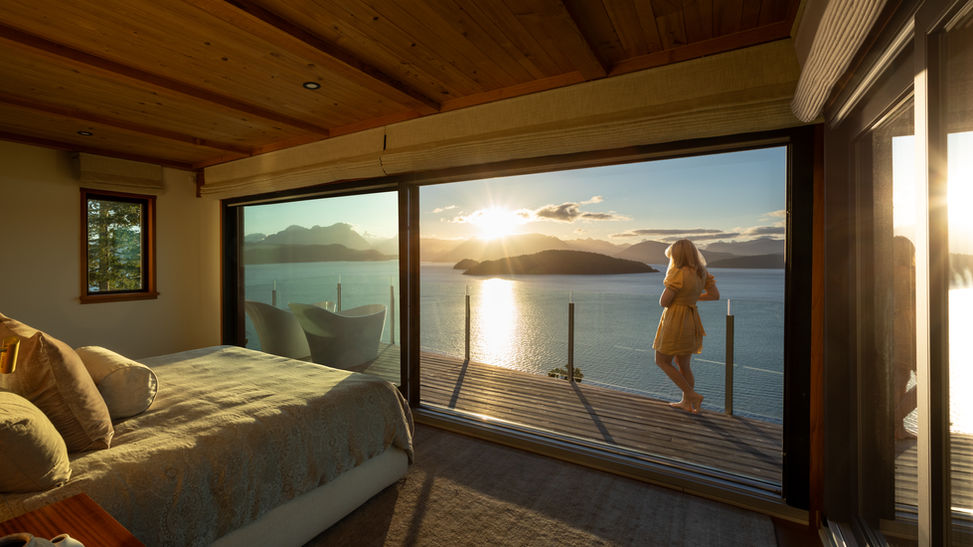 Sunrise on Cortes Island looking into Desolation Sound with Amber the designer on the patio looking outwards
