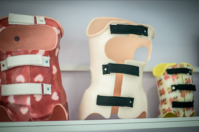 Three scoliosis braces, varied designs for treating scoliosis