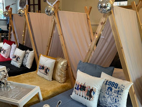 sleepover tents with different coloured blankets and pillows