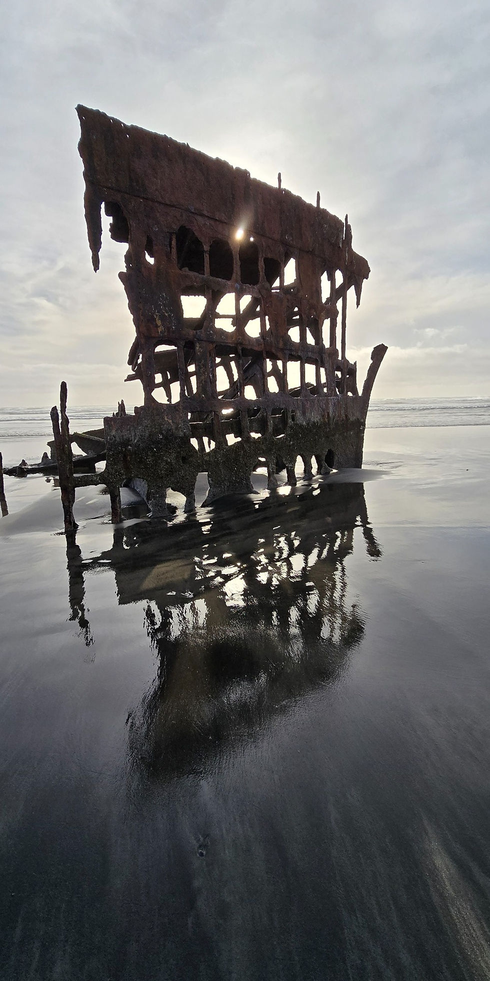 Peter Iredale at Sunset with it's reflection in the sand