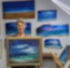 NIkole Rae Peacock with her body of work in the background