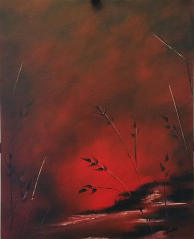 Deep Red sky and reflection in water with black textured reeds on the shore.