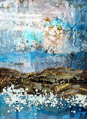 Reactive glass, fused glass panel in ocean blues and sky with metallic tones.