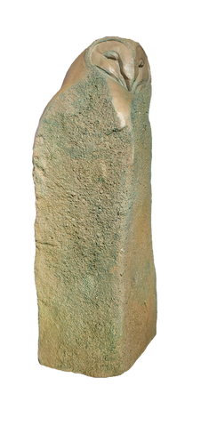 textured bronze sculpture of a barn owl emerging from stone.