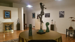 Interior of the Seaside location with just a few paintings and sculptures.