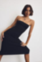 Women in a black tube dress
