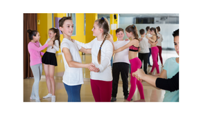 Group of smiling kids during their dance lesson