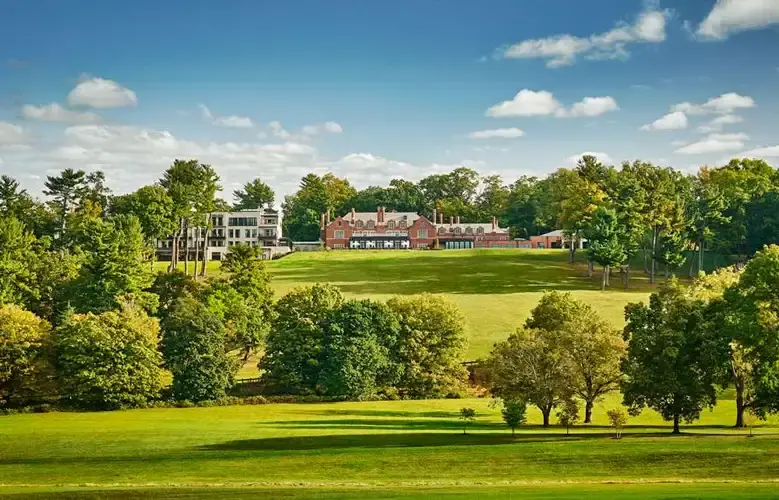 The historic 1912 Tudor mansion at Pendry Natirar set against 500 acres of rolling New Jersey countryside, featuring luxury design and a farm-to-table retreat vibe.