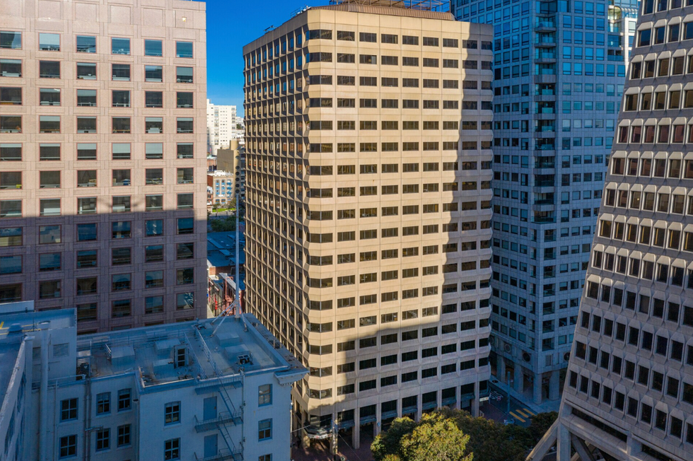 Aerial view of a high-density urban office district illustrating the vertical development envelope and competing land uses central to highest-and-best-use site analysis.