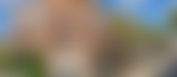 Mixed-use multifamily building with ground-floor retail in a Sun Belt growth market, reflecting typical FAR and site coverage limits under urban zoning.