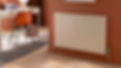 A smooth flat panel radiator against a blood orange wall