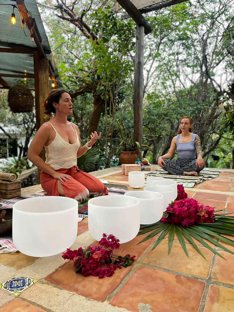 Eye-level view of open-air yoga studio surrounded by tropical plants