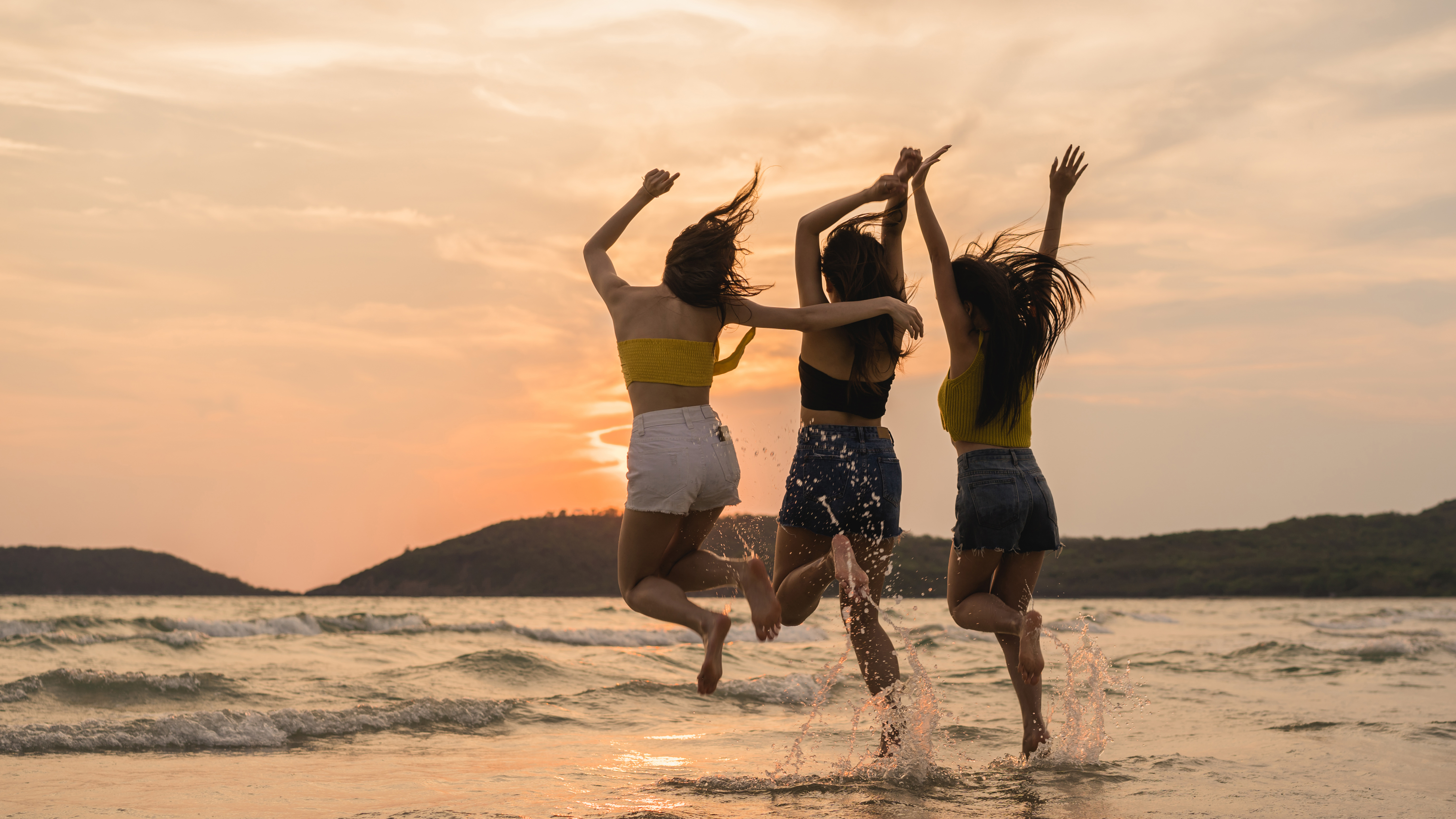 group-three-asian-young-women-jumping-beach.jpg
