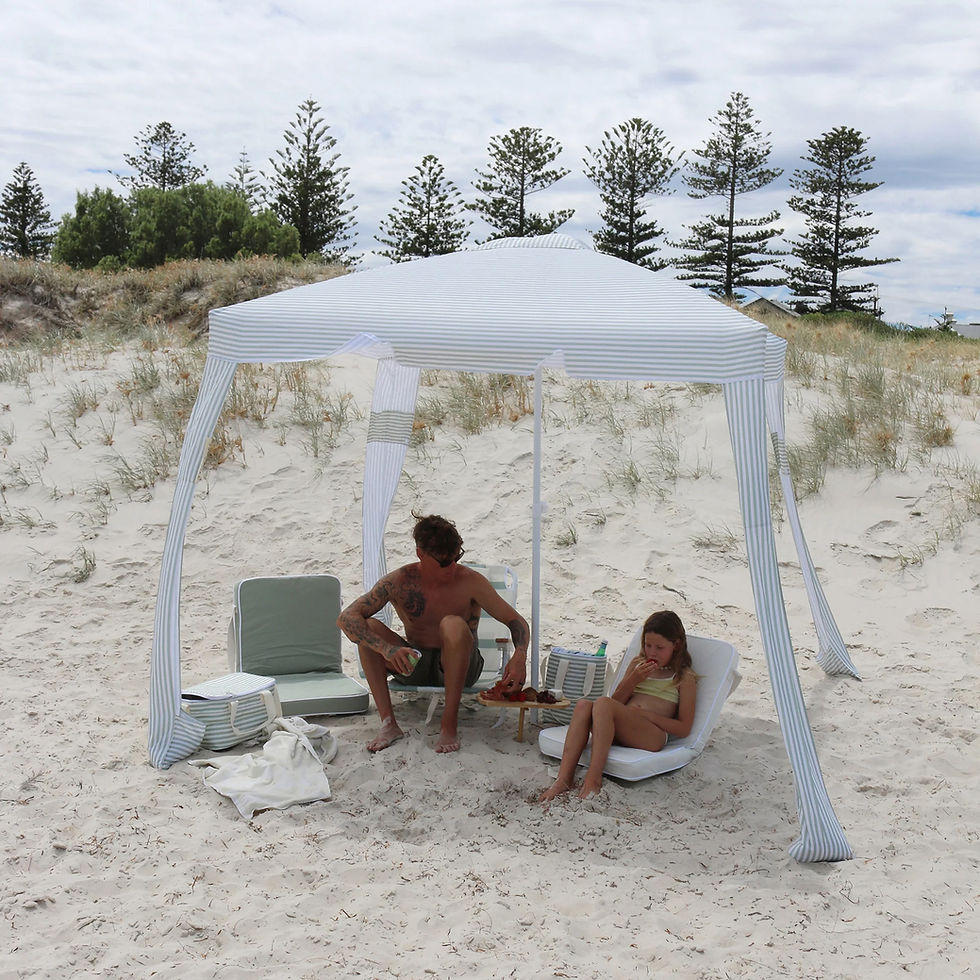 Sunnylife Beach Cabana in Sea Sage Stripe on the beach