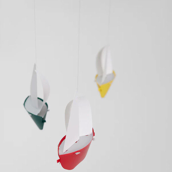 Danish handmade boat mobile by Flensted in red, yellow, blue and green