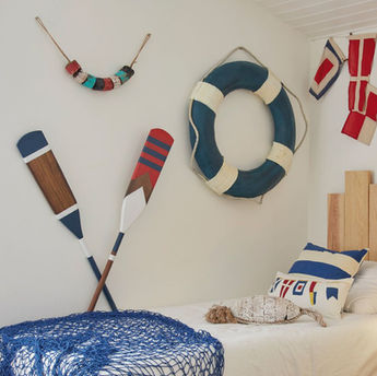 Coastal decorative accents including nautical ornaments and seaside home decor accessories