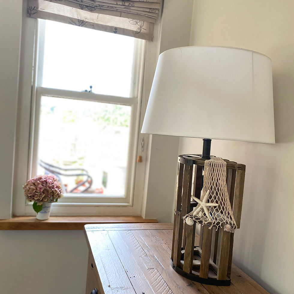 Thumbnail: lobster pot style wooden table lamp with fishing net detail and fabric shade