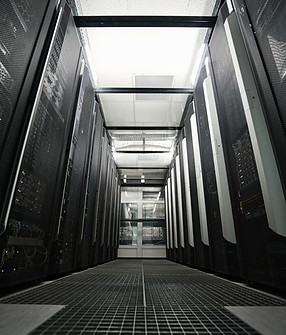 server-racks-standing-in-hallway-of-data-center-2021-10-12-03-03-07-utc.jpg