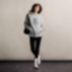 Unisex streetwear model wearing an oversized KEVIH hoodie in a clean studio background, highlighting premium oversized sweats