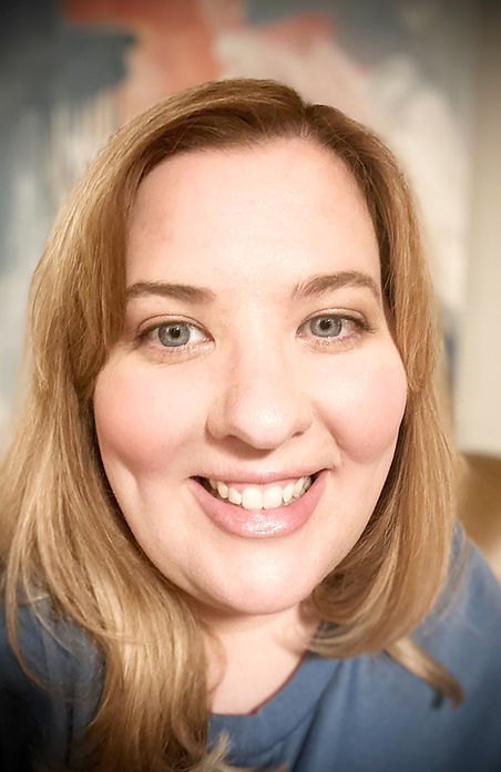 Picture of a white woman with light brown hair smiling