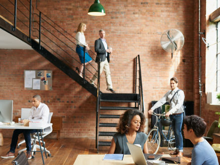 upscale Office setting, with multiple team members working together CanStaff Employment Services