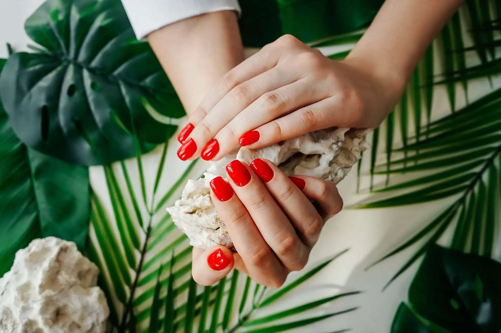 manicured-woman-s-nails-with-red-nail-polish-.webp