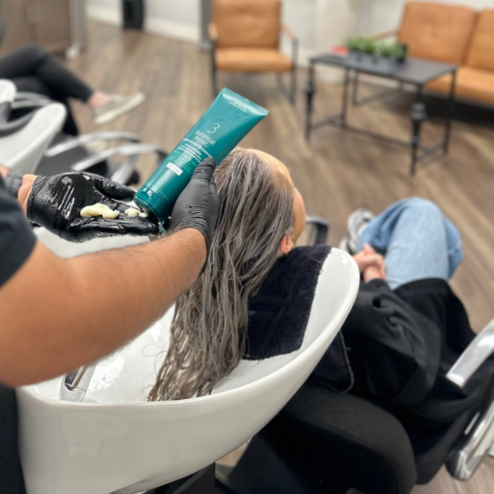 Girl getting her hair washed at Willow Aveda Salon