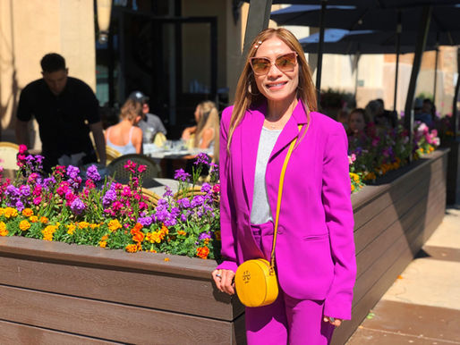 Woman in front of planter at Fountains at Roseville