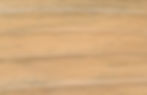 Close-up of Pine, a light wood substrate showcasing a fine, straight grain and smooth finish.