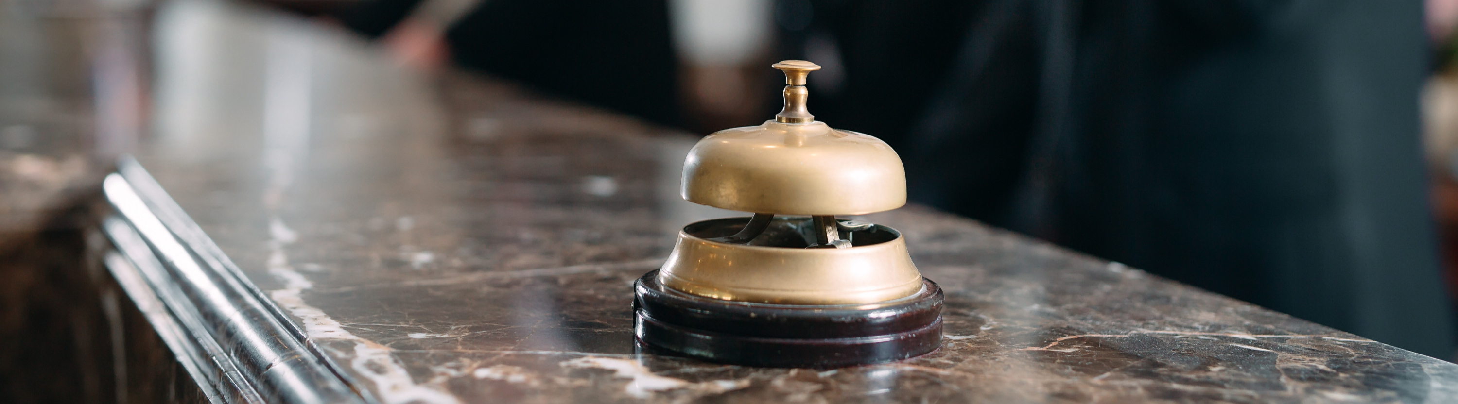 A service bell on a hotel reception desk