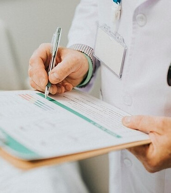 imgi_88_physician-noting-down-symptoms-patient_53876-63308.jpg