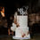 Thumbnail: Serif Block Font Mr heart Mrs shown in white on Boho tall wedding Cake