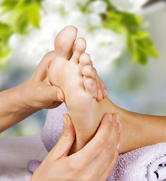Foot (feet) massage in the spa salon. Young woman having feet massage in spa salon. Feet c