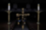 A crucifix and two candles