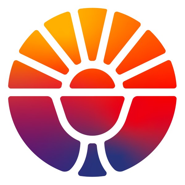 Monsignor Bernie Schmidt gives a blessing at the altar, surrounded by candles and a gathering.