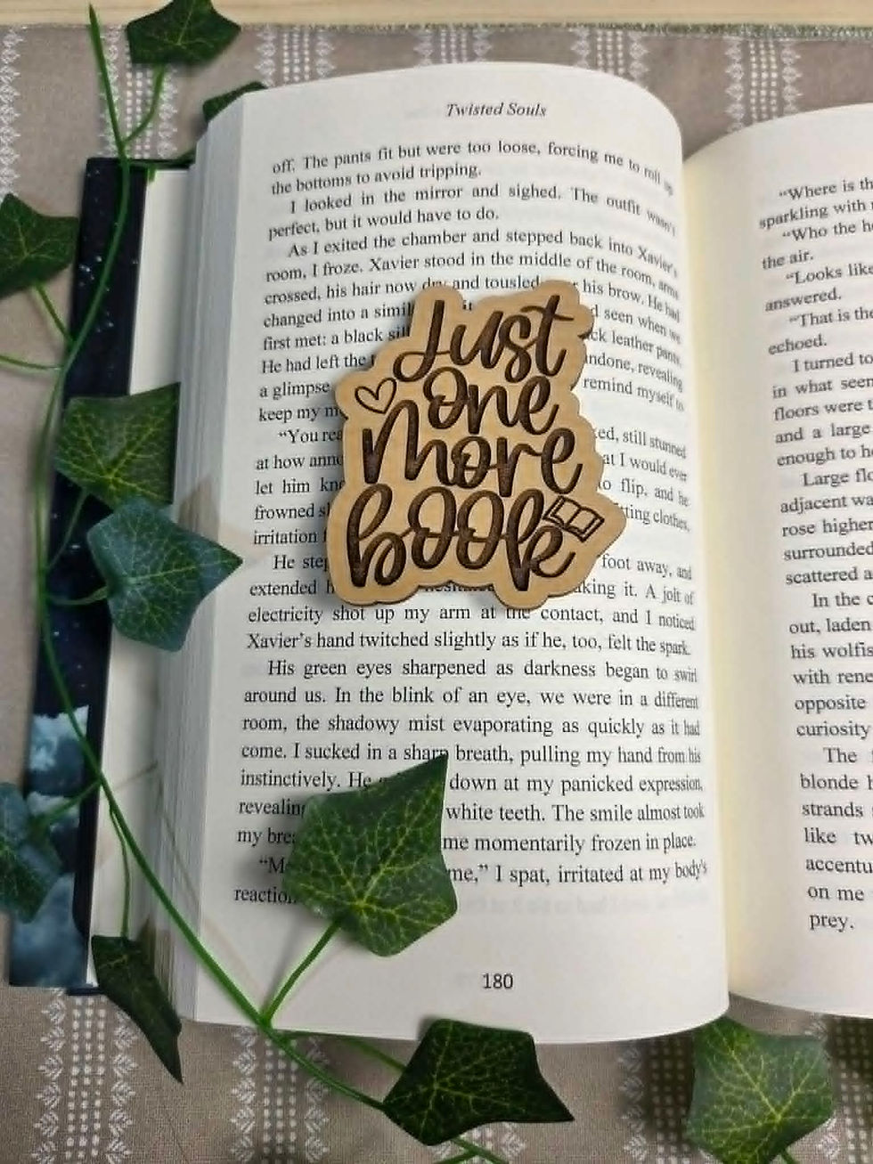 Open book with 'Just one more book' wooden charm