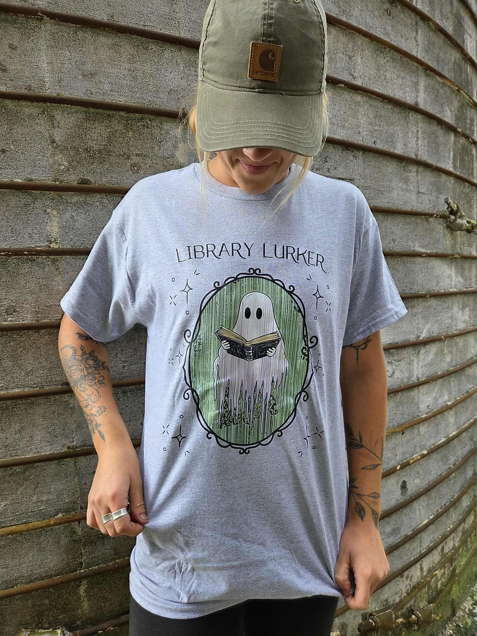 Person in grey t-shirt with 'LIBRARY LURKER' ghost graphic