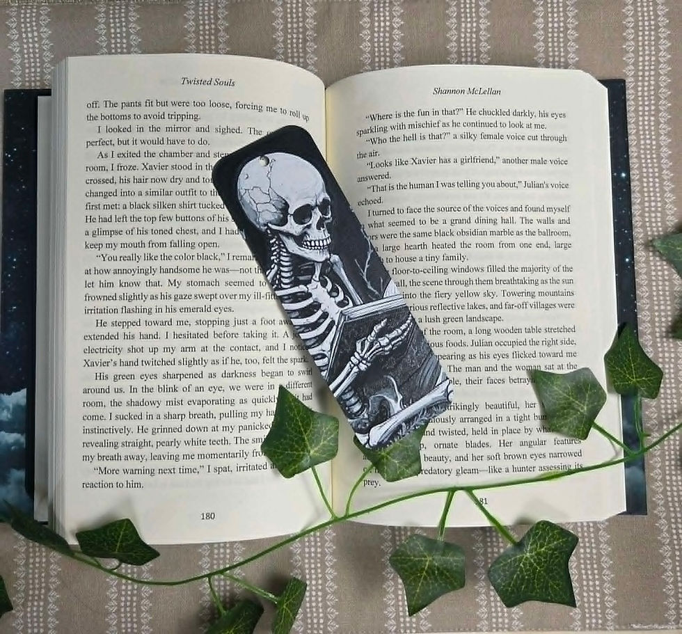 Black bookmark with skeleton reading a book in an open novel