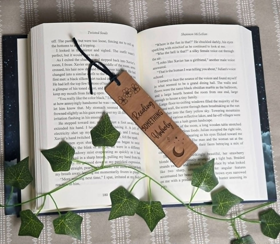 Open book with 'Reading Something Spooky' bookmark
