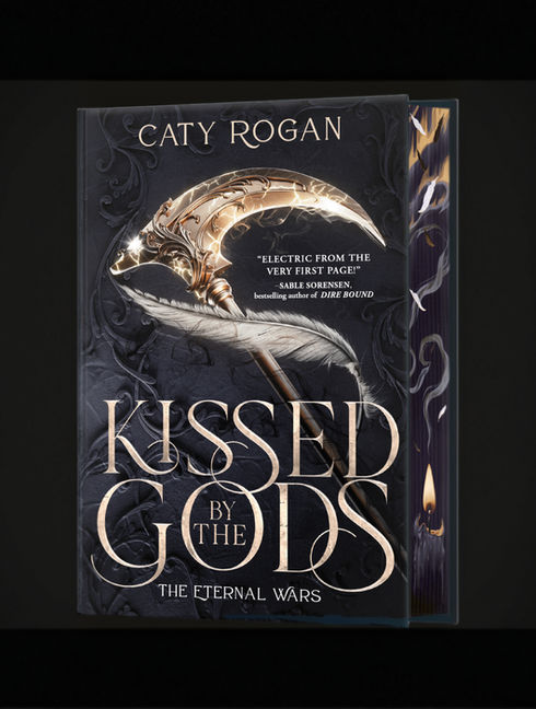 A picture of a book "Kissed Gods" by Caty Rogan.