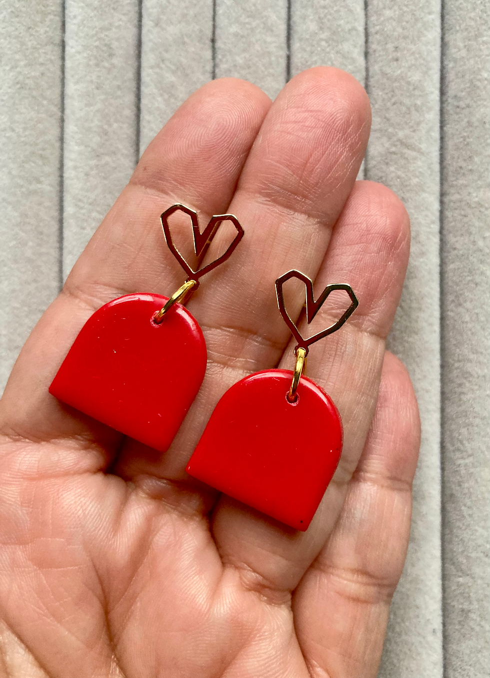 Thumbnail: Red drop earrings on gold plated heart studs