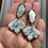 Thumbnail: White leaf earrings with metallic specs on silver plated shell stu