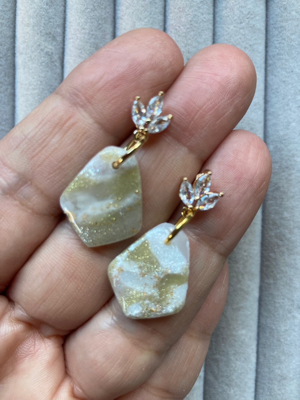 Thumbnail: Sparkly gold and white earrings on gold plated flower fittings with crystals