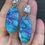 Thumbnail: Marbled blue, purple and green oval earrings on large sparkly studs
