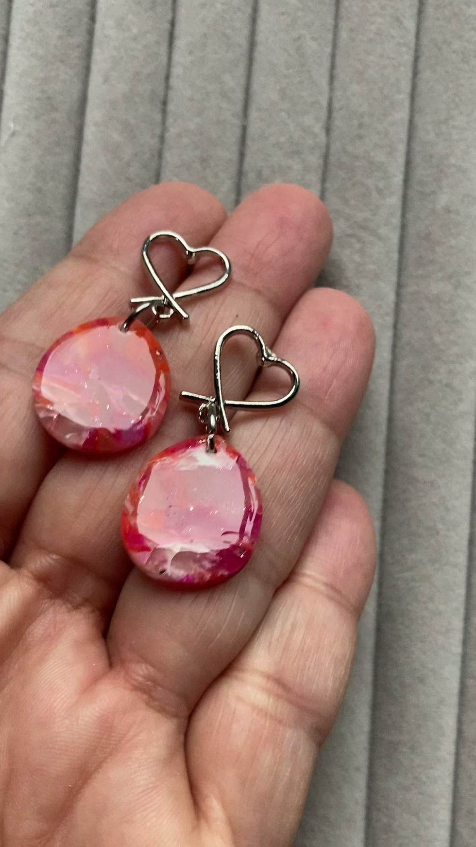 Thumbnail: Marbled pink, orange and red drop earrings on stainless steel heart studs