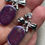 Thumbnail: Purple glitter oval earrings on stainless steel bow studs with cubic zirconia