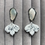 Thumbnail: White leaf earrings with metallic specs on silver plated shell stu