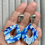 Thumbnail: Large marbled blue and white dangle earrings on long seashell studs
