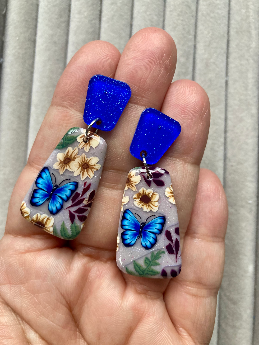 Thumbnail: Blue butterflies garden large drop earrings on acrylic blue studs