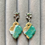 Thumbnail: Shimmery white, brown and teal earrings on starfish and cubic zirconia studs